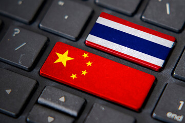 China and Thailand flags on computer keyboard - obrazy, fototapety, plakaty