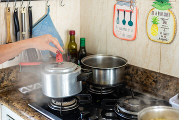 Air coming out of the pressure cooker.