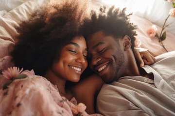 Young African American man and woman in bed and in love - obrazy, fototapety, plakaty