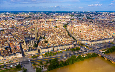Panoramic aerial view of Bordeaux city on Garonne river on sunny summer day, Gironde, France