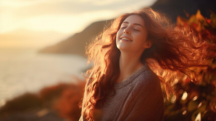 Fototapeta premium Young woman feeling the warmth of the sunlight.