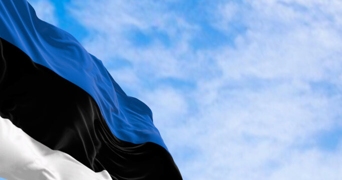 National flag of Estonia waving in the wind on a clear day