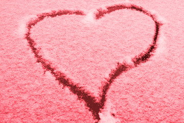 Red-Tinted Winter Love: Heart Shape on Fresh Snow Adorns Car Front, Romantic Seasonal Scene.