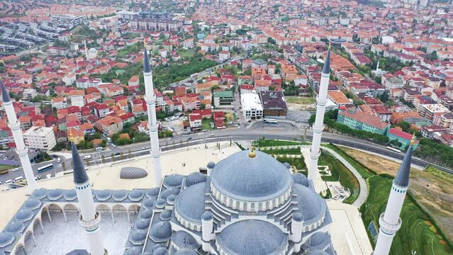 Fly over. Camlica Mosque and surrounding neighborhood in Istanbul. First ever prayer held at Turkey's largest Mosque. Occupying an area of 15000 square meters on the Anatolian side of city
