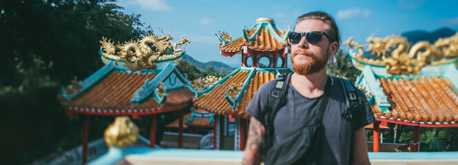 A tourist on an excursion to a mountain temple in Thailand
