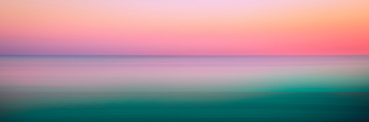Romantic foggy motion blur sunset or sunrise landscape for soft warm-toned pastel seascape...