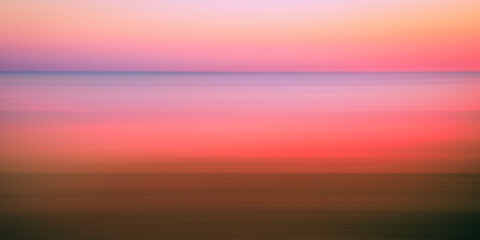 Romantic foggy motion blur sunset or sunrise landscape for soft warm-toned pastel seascape...