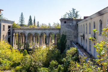 abandoned building with a colonnade, former sanatorium - obrazy, fototapety, plakaty