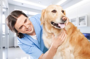 Happy vet doctor in uniform with little dog