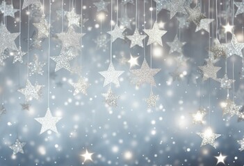 Glittering silver stars suspended against a soft blue bokeh background