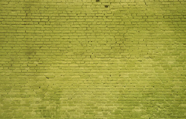 The texture of the brick wall of many rows of bricks painted in yellow color