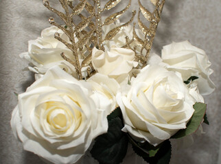 Closeup view of a bouquet of white artificial roses	