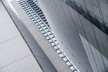 Low angle perspective of a building complex.
Monumental view of architectural walls.
