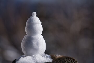 Hokkaido, Japan - November 16, 2023: A small snowman in Hokkaido, Japan
