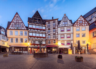 Facades of old traditional houses in the market square at dawn. Cochem. Germany.
