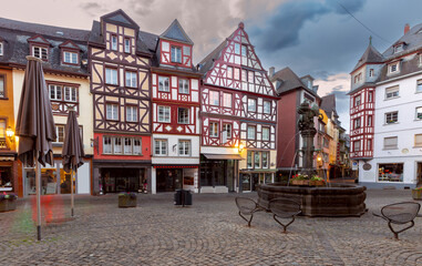 Facades of old traditional houses in the market square at dawn. Cochem. Germany.