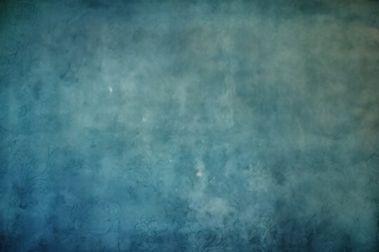 Beautiful blue color grunge background with copy space, abstract stucco wall texture with holes and scuffs