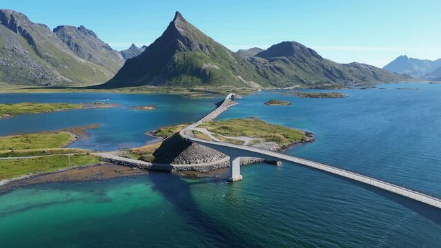 Lofoten Islands Fredvang Bridge and Scenic Route during summer in Norway - Aerial Backwards