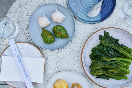 plates of dim sum on speckled surface