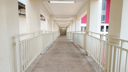 perspective hallway in the corridor with railings in the white building