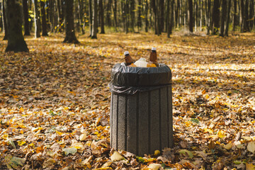 Fototapeta premium Garbage in the forest. Love nature. Earth day and environmental care.