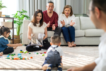 Portrait of happy love family asian mother playing and teaching help adorable little asian baby learning to crawling.Mom help first step with cute son beginnings development at home.Love of family