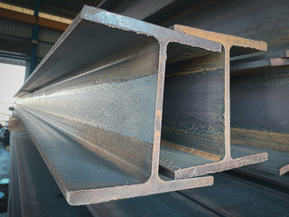 Metal profiled steel beams are packed at the metal products warehouse, H-beam steel and Wi-Frank...