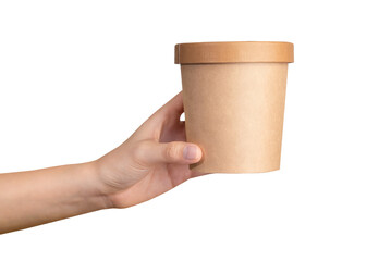 Hand holds craft paper soup cup on isolated background.