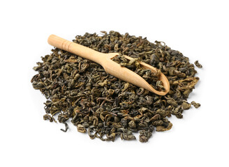Wooden scoop with dry green tea leaves on white background