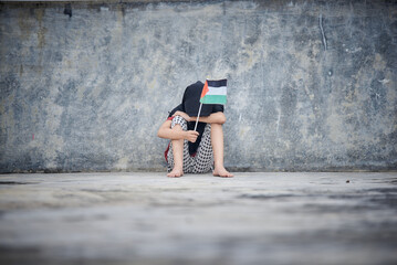 Sad Little girl holding Palestine Flag sends a powerful message of support and empathy to the world 