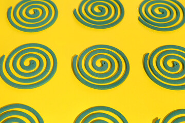 Mosquito spirals on yellow background