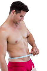 Digital png photo of happy caucasian man using measuring tape over stomach on transparent background