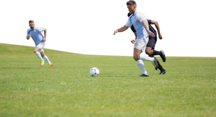 Digital png photo of diverse male footballers playing on sunny court on transparent background