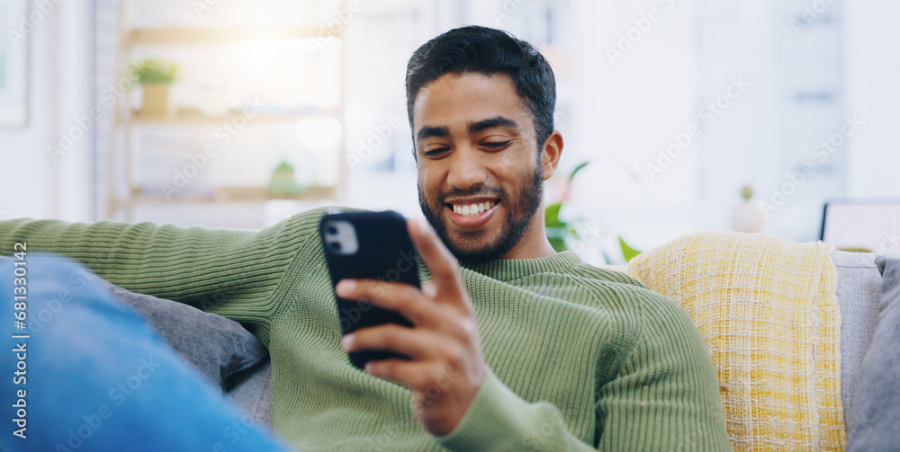 Poster man, living room couch and happy with phone, smile and click for contact, meme and notification in h