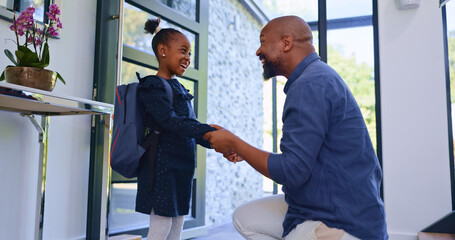 Backpack, hello and father with girl school child in a house for greeting, welcome or bond with love. Happy, black family or student kid with dad in a doorway for conversation, support and security - obrazy, fototapety, plakaty