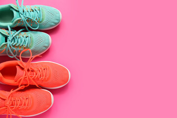 Different stylish sneakers on pink background