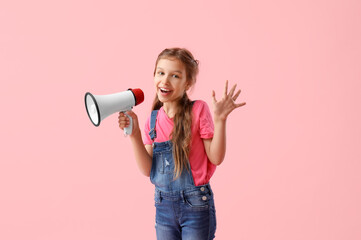 Little girl with megaphone waving hand on pink background