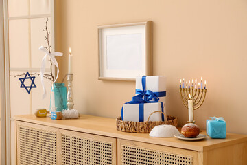 Wooden cabinet with decorations for Hanukkah celebration in living room