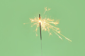 Beautiful Christmas sparkler on green background
