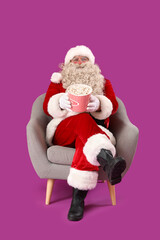 Santa Claus with tasty popcorn on purple background