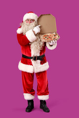 Santa Claus with box of tasty pizza on purple background