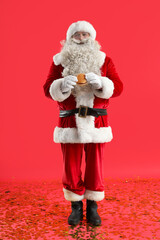 Santa Claus with tasty burger on red background