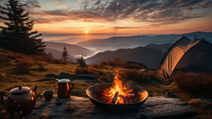 Flaming campfire in the morning wilderness in mountain landscape
