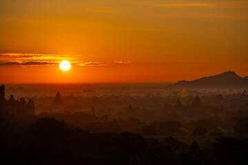 group of ancient pagodas in Bagan at the sun set, myanmar