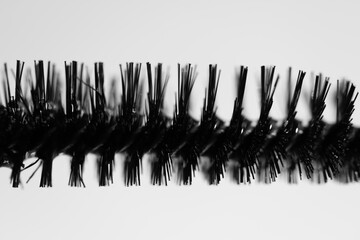 close up of a mascara on grey background