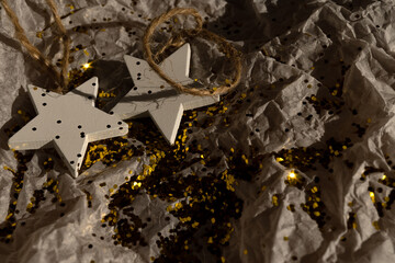 Christmas decorations, glitter lie on gift wrapping paper. christmas background