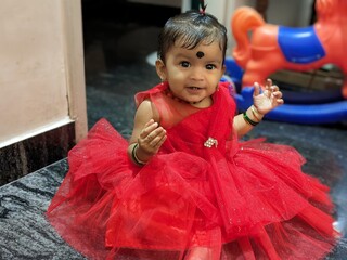 Little Baby girl portrait in a Red dress