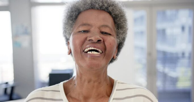 Portrait of happy african american senior woman in hospital, slow motion
