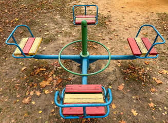 Swings on the playground in autumn
