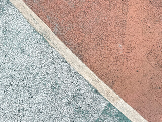 Old covering on a sports ground as an abstract background. Texture